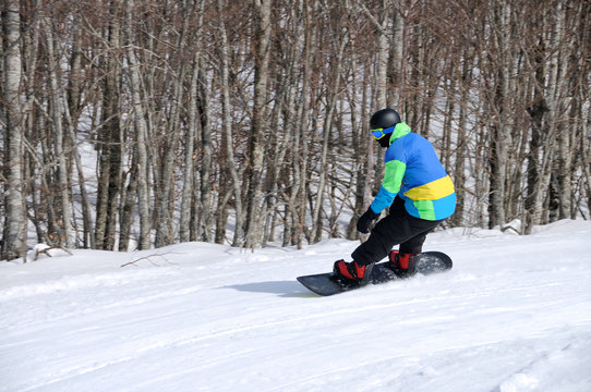 Man on snowboard in action