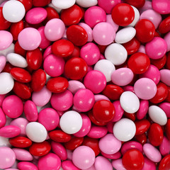 Colorful chocolate Valentine's candy coated in pink, red - 60604109