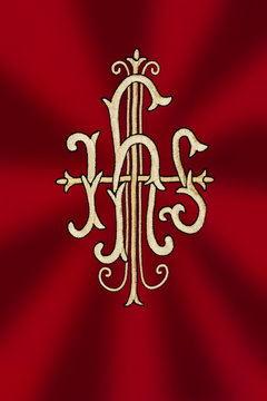 JHS traditional Catholic monogram at liturgical dress