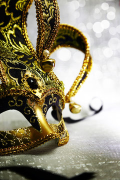Vintage venetian carnival mask with glittering background