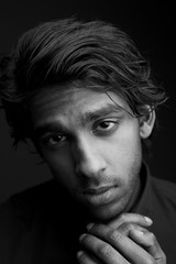 Fototapeta premium Young man with hand to chin