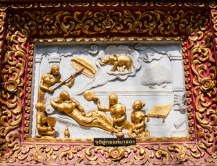 Ancient golden carving wooden window of Thai temple. Thailand