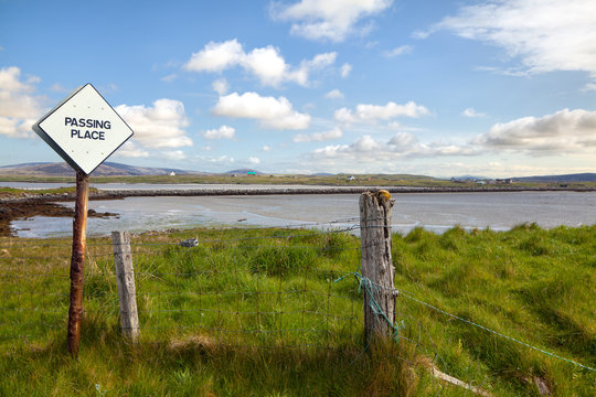 Scottish landscape with passing place road sign