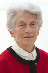 Close-up portrait of an elder woman isolated in studio