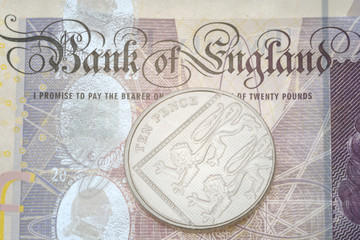 Fototapeta na wymiar Detail of bank note and ten pence piece