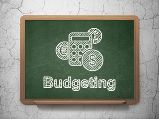 Business concept: Calculator and Budgeting on chalkboard