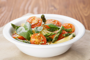 simple italian pasta penne with tomatoes and basil
