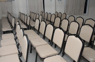 row of chairs in a hall