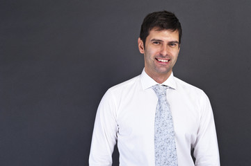 businessman standing on grey background