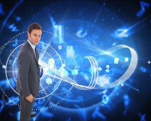 Composite image of serious businessman standing