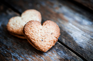 Heart cookies on rustic wooden background