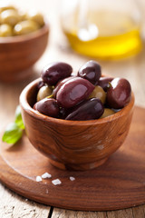 black and green marinated olives in bowl