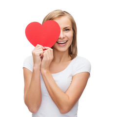 smiling woman in white t-shirt with heart