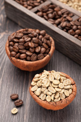 Roasted coffee and green coffee in bowls