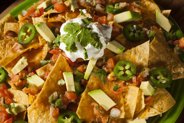 Homemade Unhealthy Nachos with Cheese and Vegetables