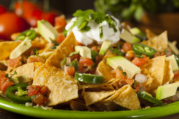 Homemade Unhealthy Nachos with Cheese and Vegetables