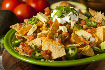 Homemade Unhealthy Nachos with Cheese and Vegetables