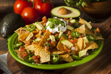 Homemade Unhealthy Nachos with Cheese and Vegetables