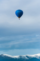 Blue balloon in the blue sky