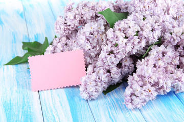 Beautiful lilac flowers on table close-up
