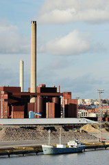 industrial building and chimney and boat
