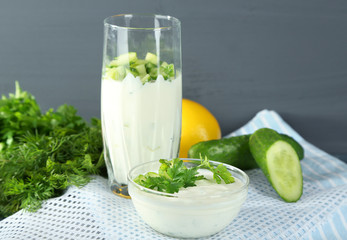 Cucumber yogurt in glass and bowl,