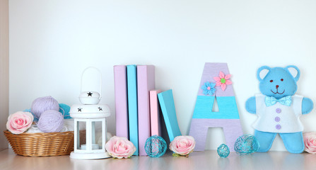 Shelf decorated with handmade knit letter