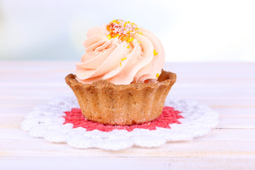 Tasty cake on table on light background