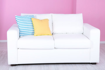White sofa in room on pink background