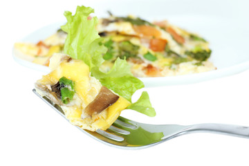 Omelet with mushrooms isolated on white