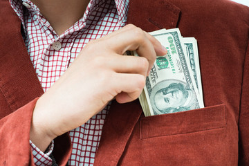 A man holds a U.S. $