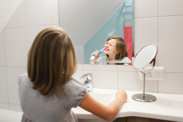 Little girl brushing her teeth