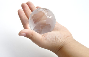 clear glass globe hand  white background power earth world
