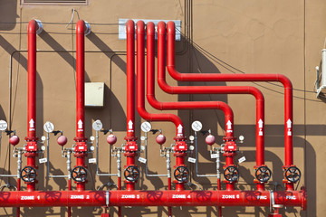 splinker alarm system red water pipe brown wall outdoor