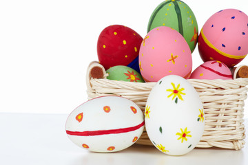 Eggs in basket on white a