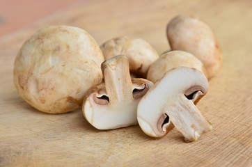 Champignon on wooden background