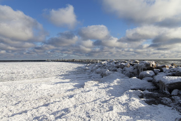 Old breakwater in winter.