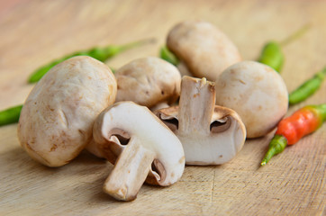 Champignon on wooden background