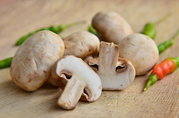 Champignon on wooden background