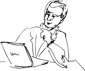 man sitting at table with laptop reading