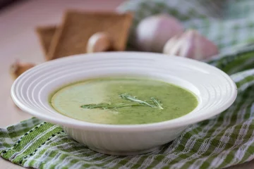 Poster Green garlic cream soup with leaves rukola, arugula, healthy © maria_lapina