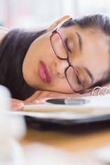 Closeup of businesswoman sleeping on desk