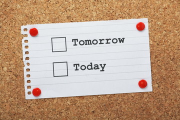 Tomorrow or Today Tick Boxes on a cork notice board