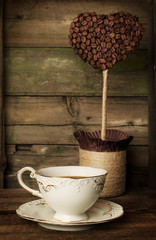 cup of coffee with a decorative topiary