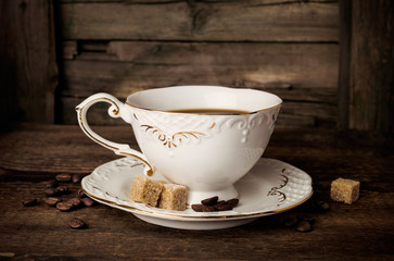 elegant coffee cup with beans and sugar cubes