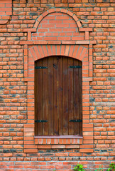 Red brick wall with a window