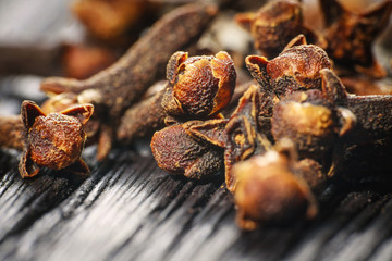 pile cloves on wood background
