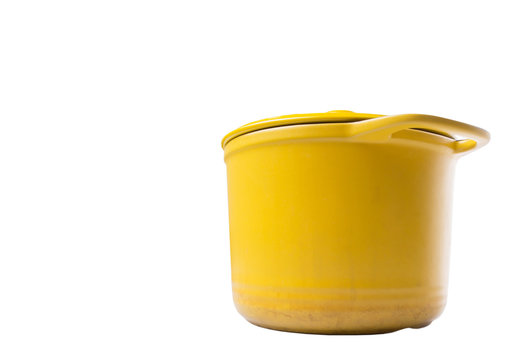 Yellow cooking pot over white background