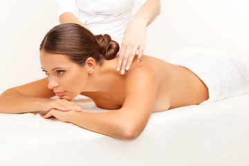 Obraz na płótnie Canvas Massage. Close-up of a Beautiful Woman Getting Spa Treatmen