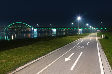 Bicycle lane and bridge at night